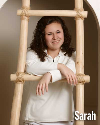 Studio One Senior Girl leaning on kiva ladder
